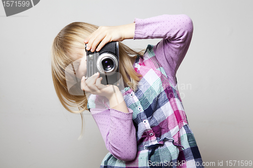 Image of Little girl with camera