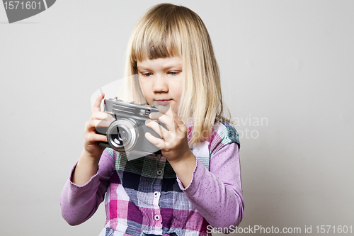 Image of Little girl with camera