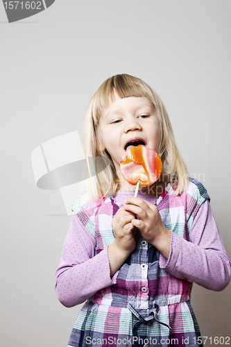 Image of Little girl with lollipop