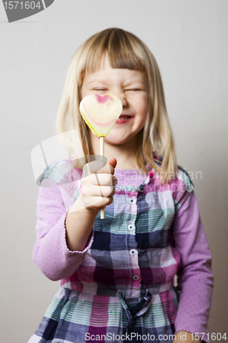 Image of Little girl with lollipop