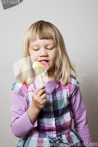 Image of Little girl with lollipop