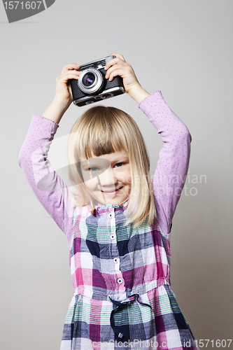 Image of Little girl with camera