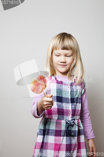 Image of Little girl with lollipop