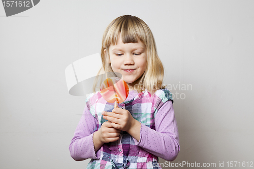 Image of Little girl with lollipop