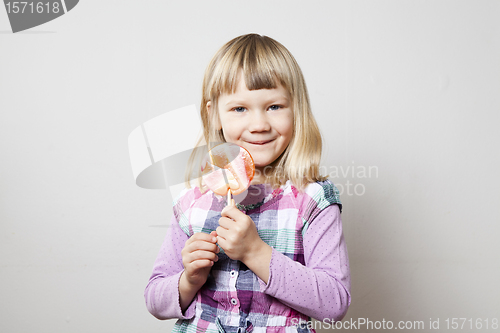 Image of Little girl with lollipop