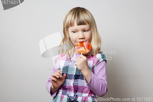 Image of Little girl with lollipop