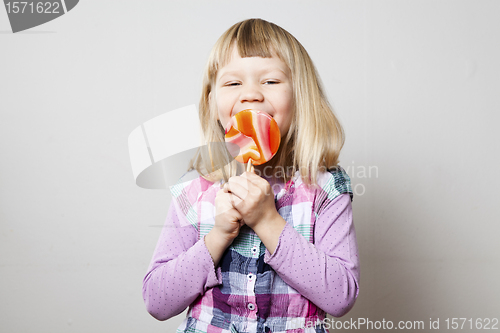 Image of Little girl with lollipop