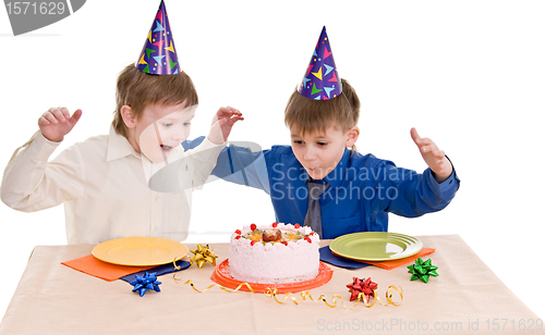 Image of two boy wich cake