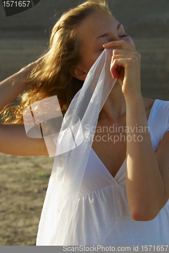 Image of Young woman with white scarf