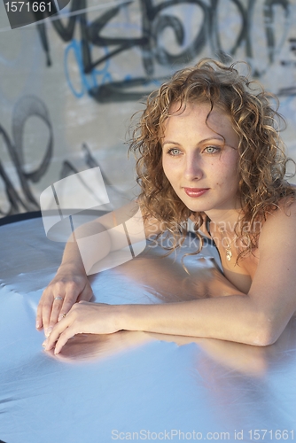 Image of Young woman on roof