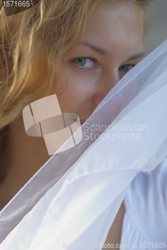 Image of Young woman with white scarf