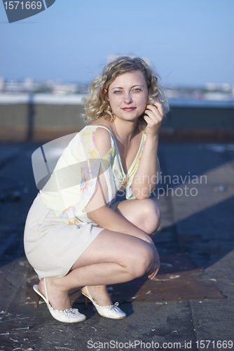 Image of Pretty girl on roof