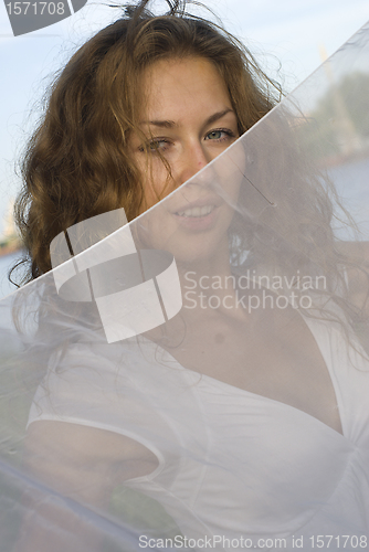 Image of Young woman with white scarf