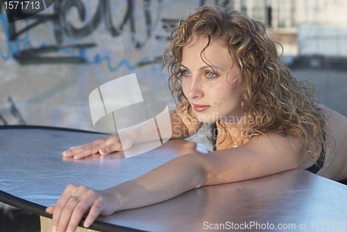 Image of Young woman on roof