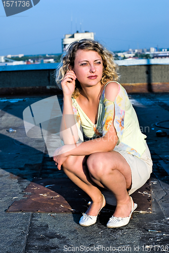 Image of Pretty girl on roof
