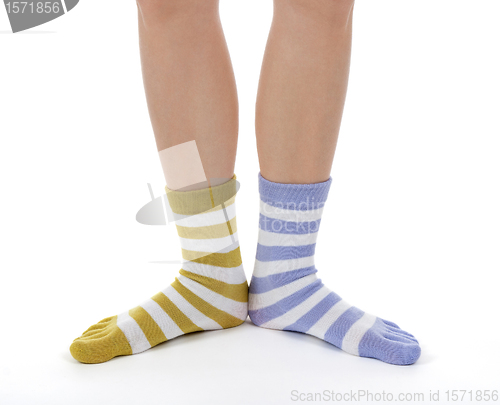 Image of Funny legs in socks of different colors