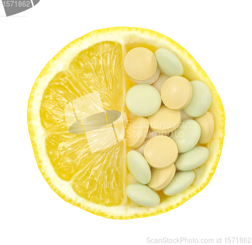 Image of Close up of lemon and pills isolated – vitamin concept - vitamin c