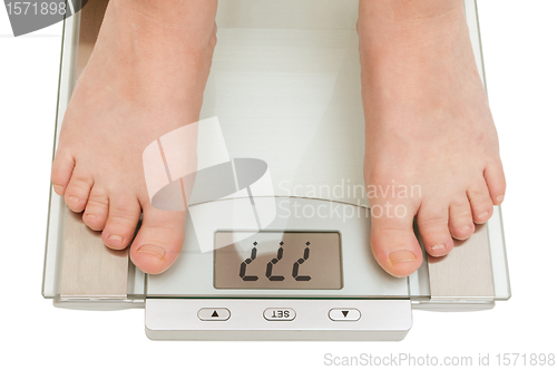 Image of Female feet on scales