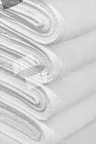 Image of Stack of new white towels close-up - background