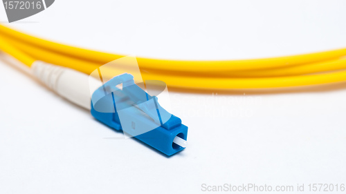 Image of Optical single mode LC patch cord on white background. 