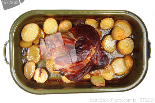 Image of roasted pork knuckle with potatoes