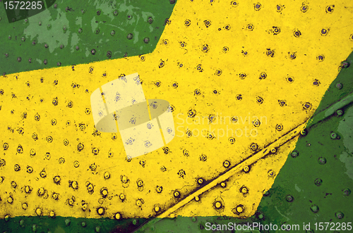 Image of Green yellow paint metal floor closeup background 