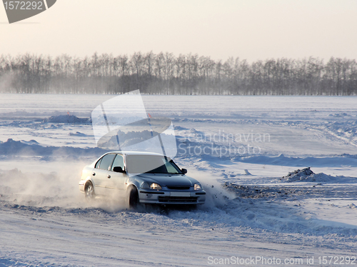 Image of Car on winter road.