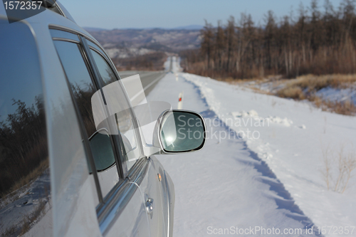 Image of Car on winter road.