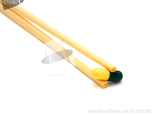 Image of sushi tablet on chopstick