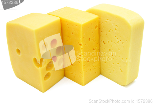 Image of three pieces of different kinds of cheese