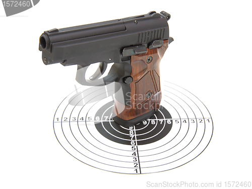 Image of The pistol with the brown handle