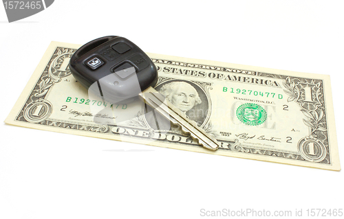 Image of The car key lies on a dollar 