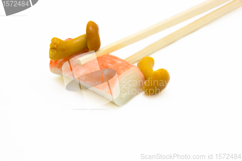 Image of sushi on chopstick with mushrooms