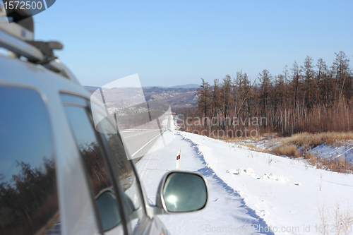 Image of Car on winter road.