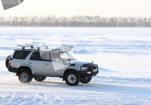 Image of Car on winter road.