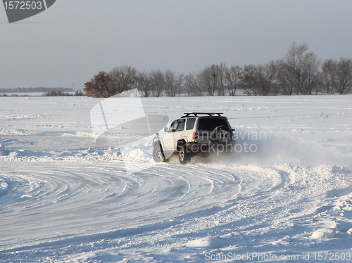 Image of Car on winter road.