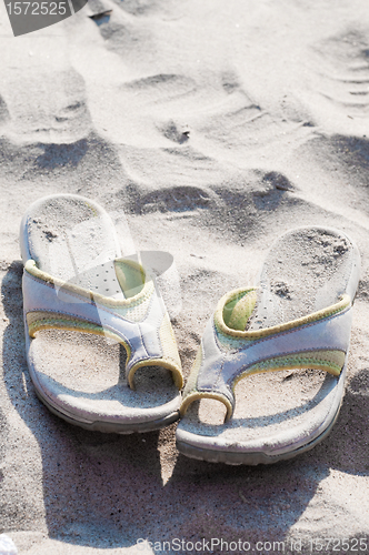 Image of Flip-flops and sand