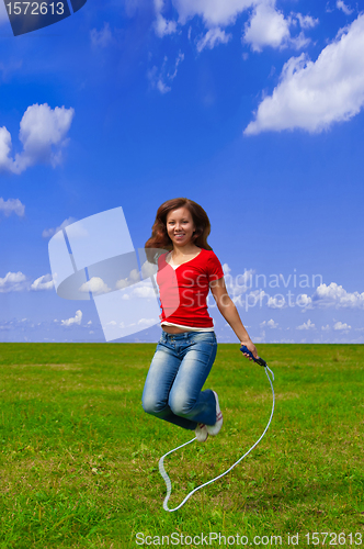 Image of Young woman with skipping rope