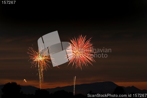 Image of Firecrackers In The Sky During Sunset