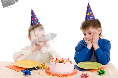 Image of two boy wich cake