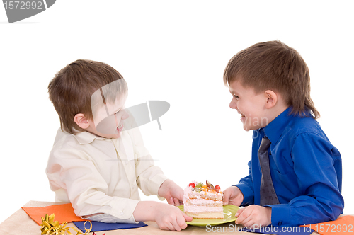 Image of two boys with cake