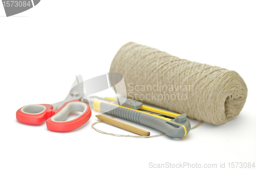 Image of Pack thread, paper knife, pensil and scissors