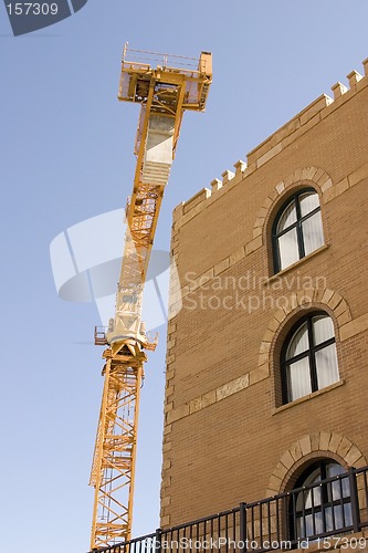 Image of Construction Crane next to a Building