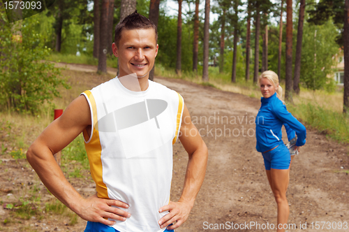 Image of Sportsmen. The young man and the girl 