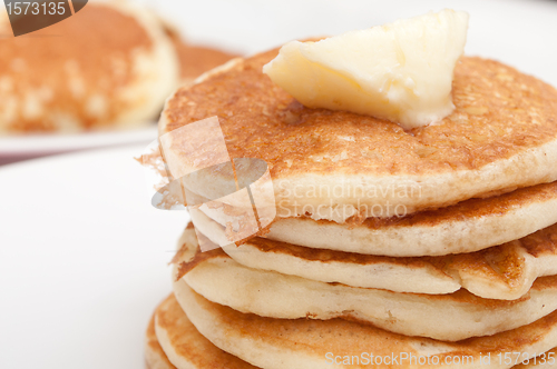 Image of Pancakes With Butter and Maple Syrup