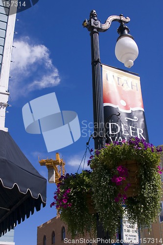 Image of Close up on a Street Lamp with Skies and Clouds