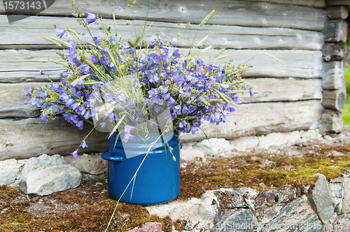 Image of bouquet of field flowers amidst the rural landscape