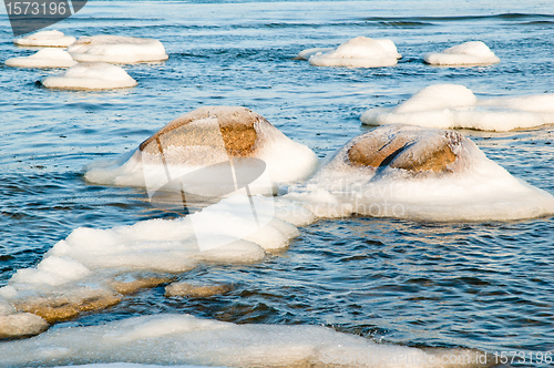 Image of  ice-covered stones along the shores of the Baltic Sea 