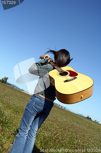 Image of Woman guitar player