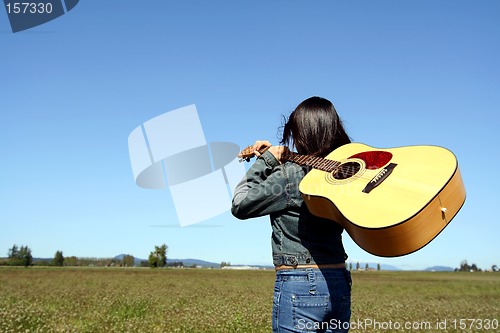 Image of Woman guitar player